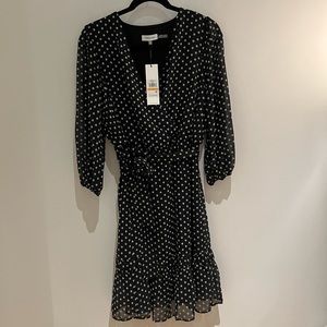 Calvin Klein black flowy dress, size small. New with tags.